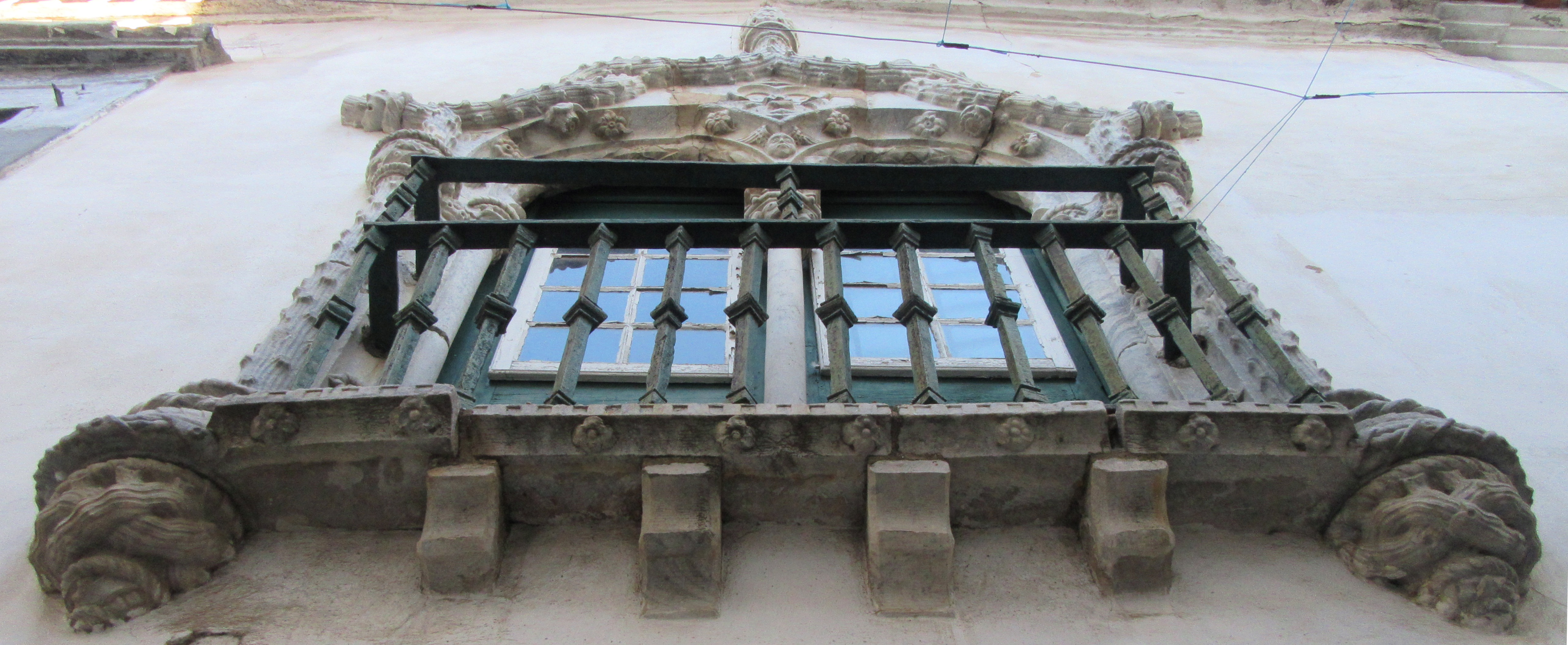 An ornate Medieval upper-story window in Beja